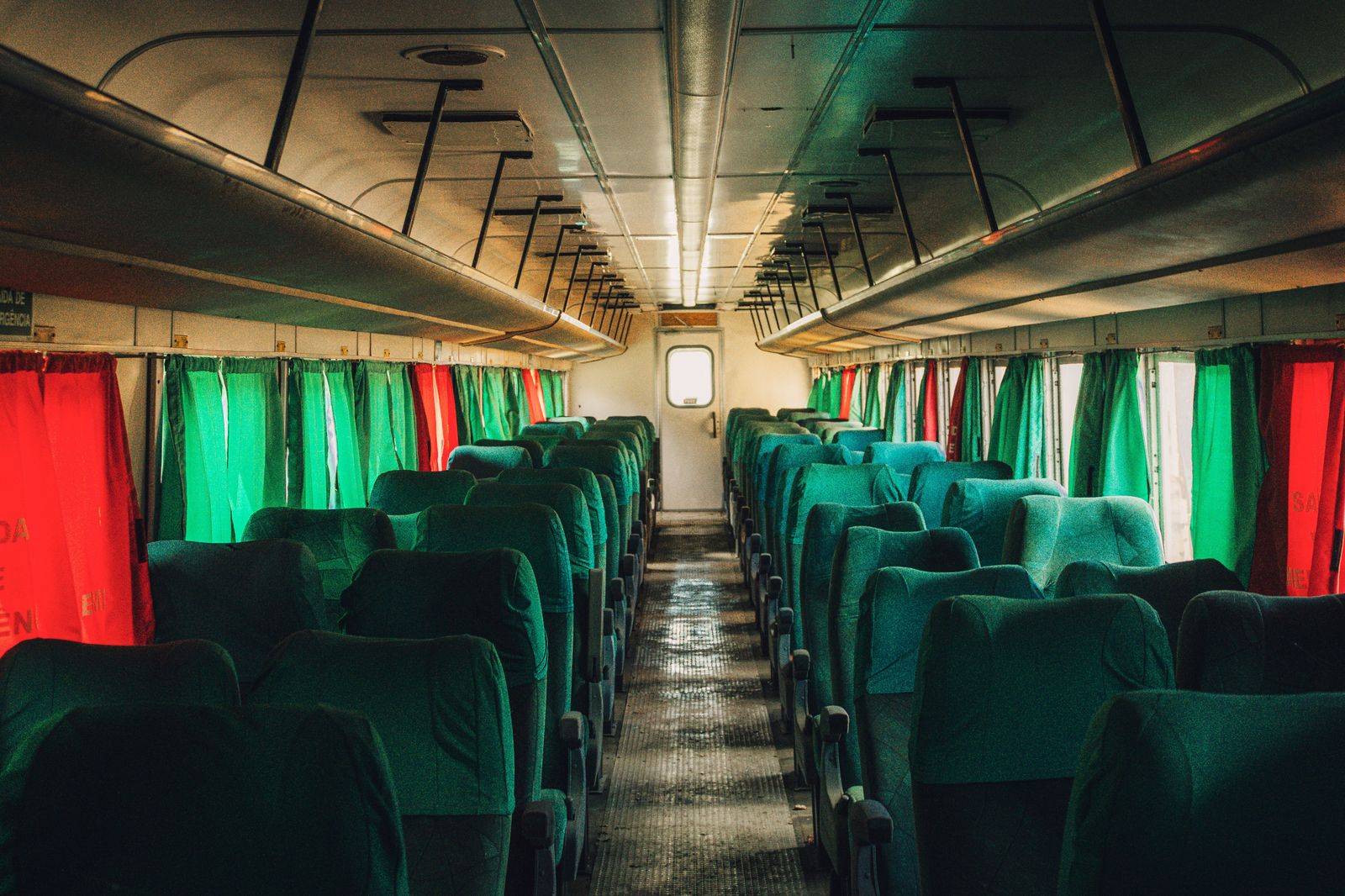 Rows of individual seats inside a twelve-passenger Sprinter used for crew shuttles