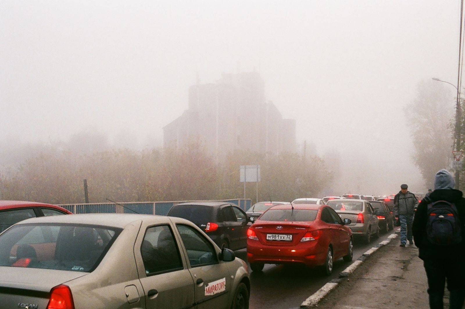 Cars waiting at a Toronto hospital entrance as a chauffeur collects a patient