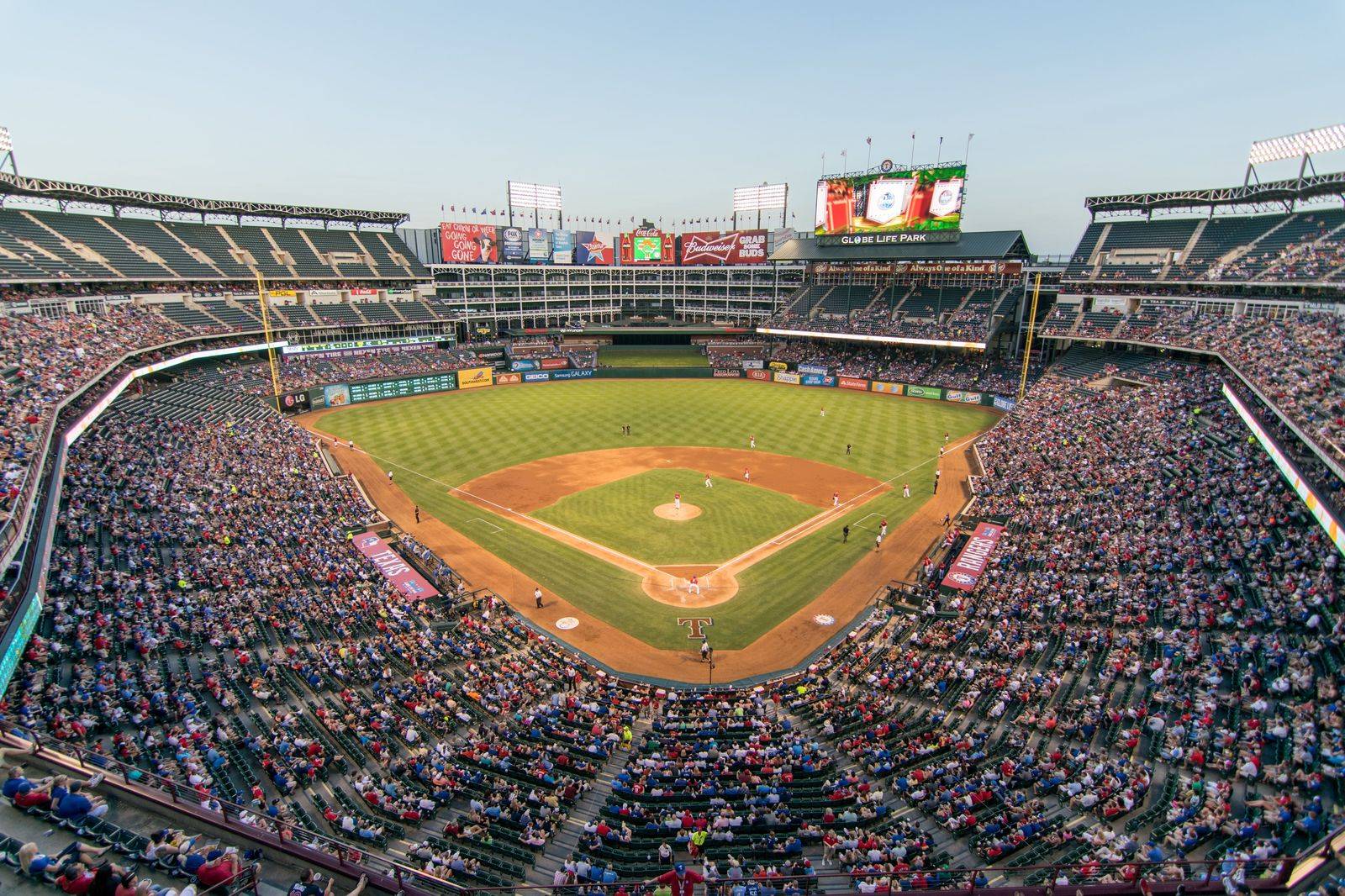 A baseball stadium crowd in the evening, the kind of game night a Toronto limo serves