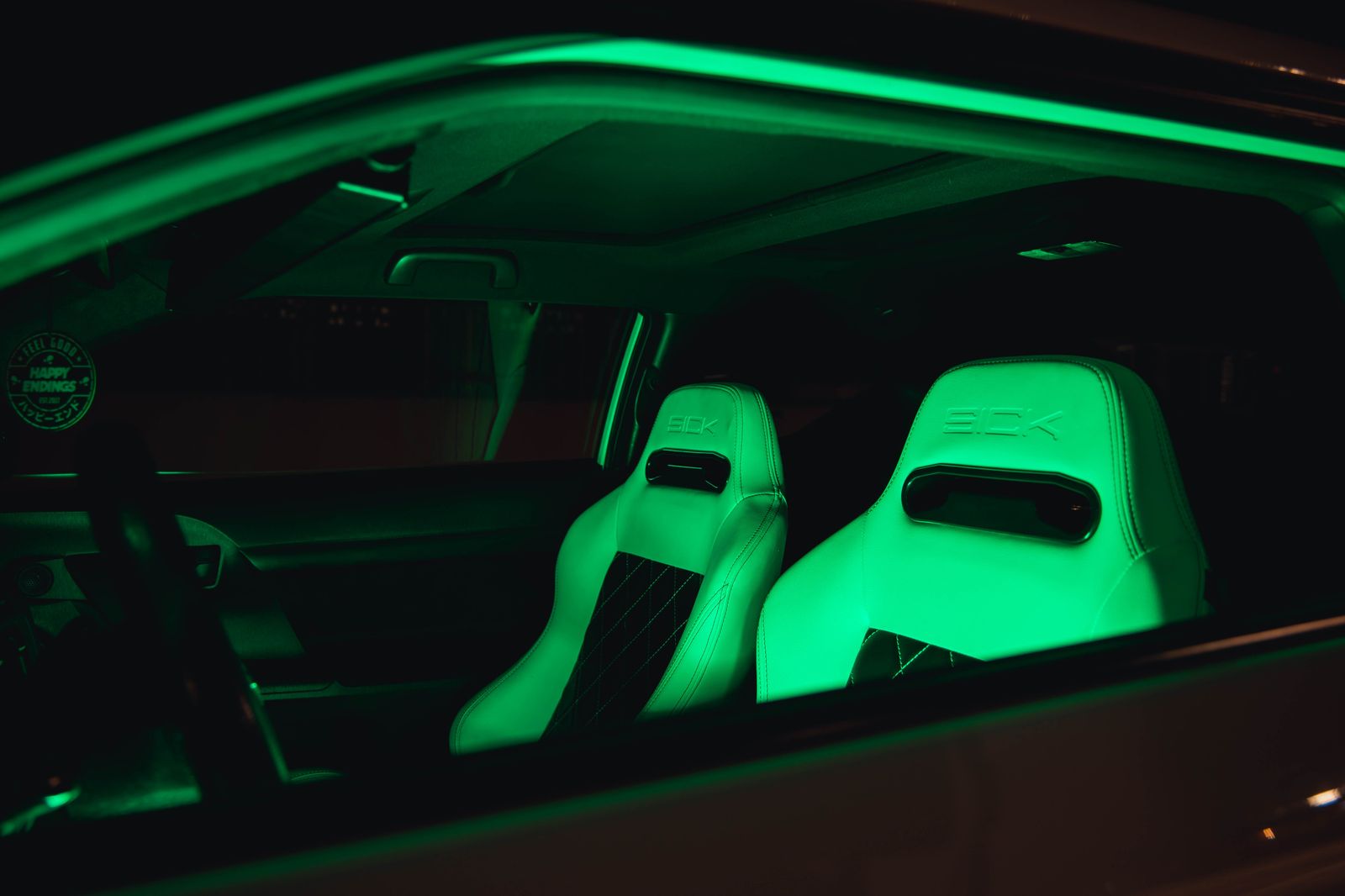 Leather lounge seating and mood lighting inside a stretch limousine