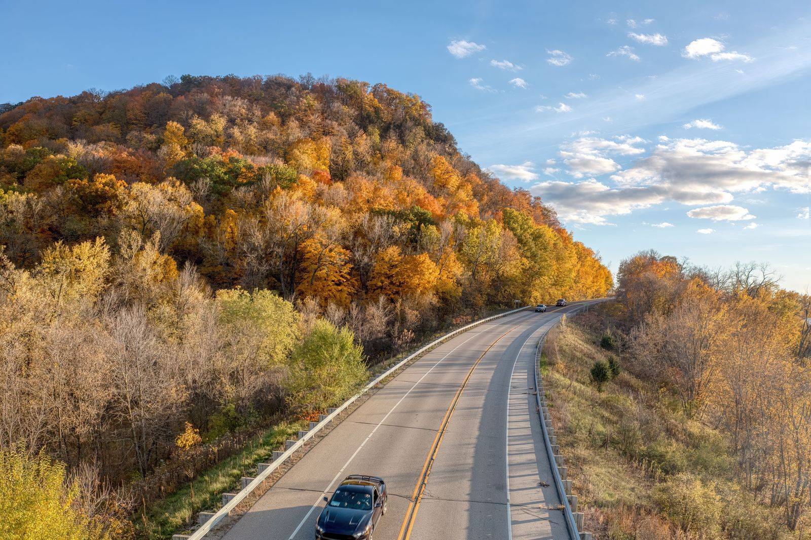 The interstate winding through forested hills on the long drive between Boston and Toronto