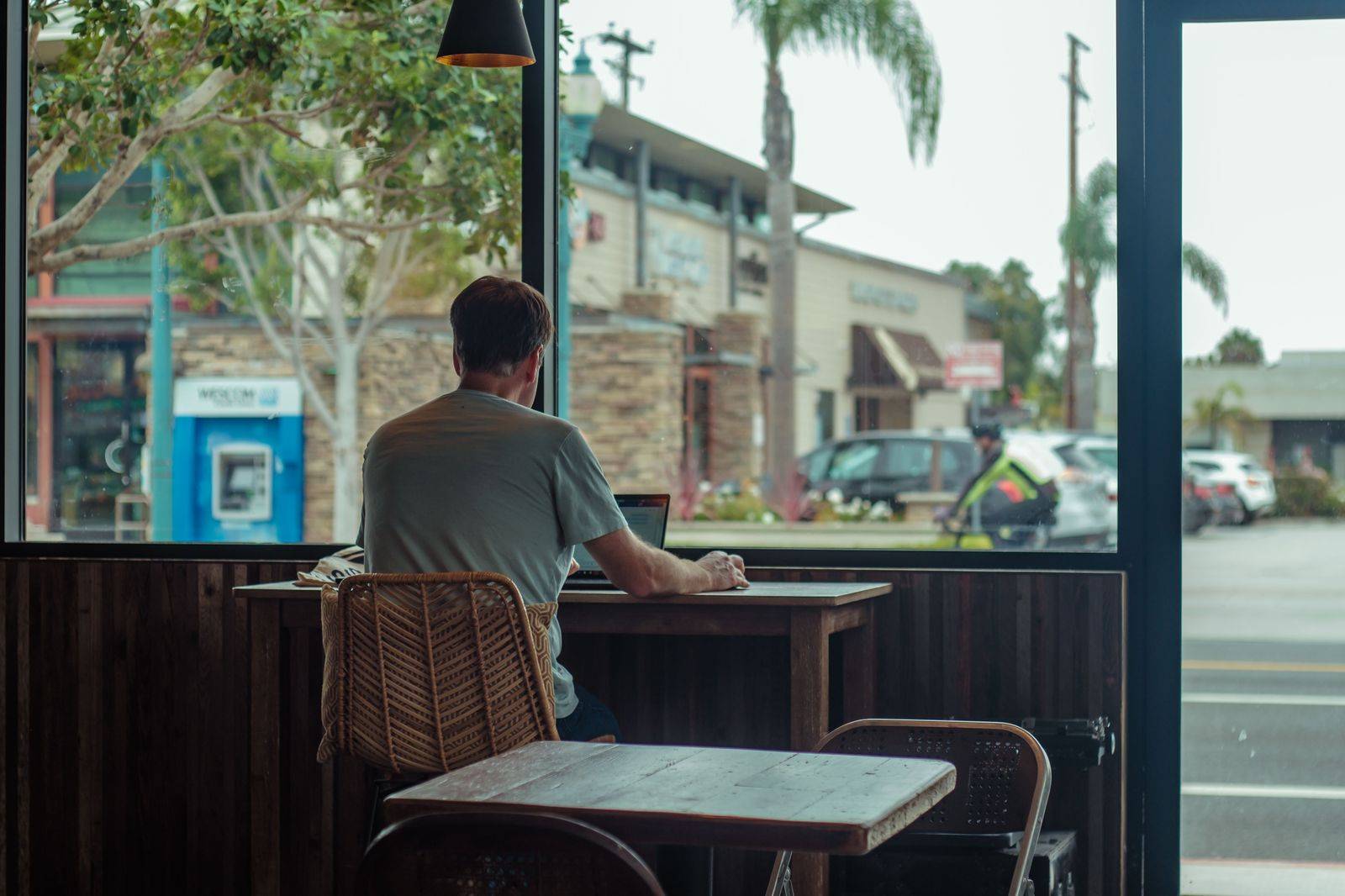 A passenger works on a laptop in the back seat during a long Toronto to Cleveland drive